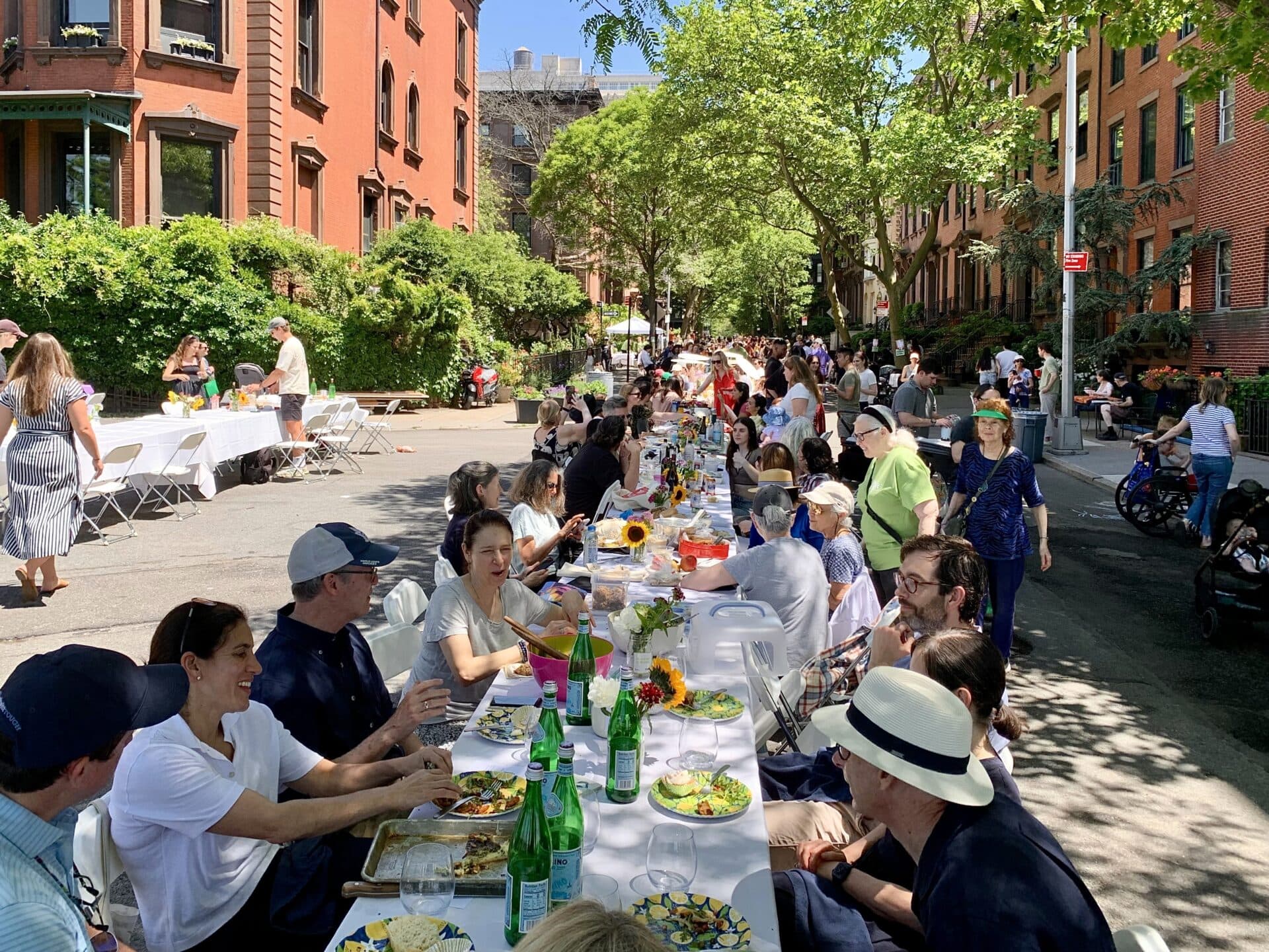 Neighbors sharing a meal at a Longest Table event
